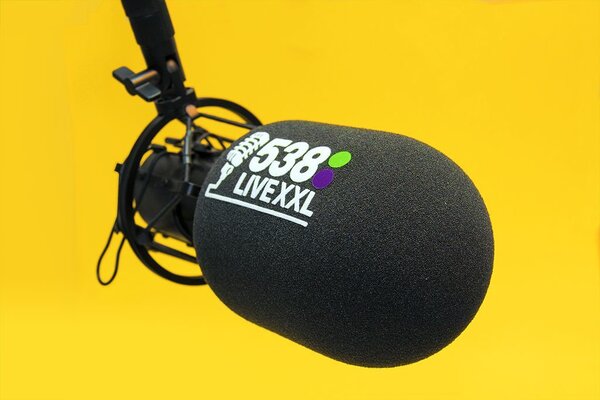 Radio Liveyxl branded studio microphone windshield with black foam cover and colorful logo