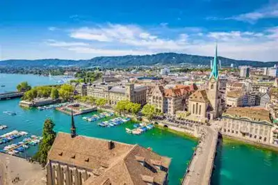 Limmat River view and historic buildings in Zurich during the Europe Tour Package