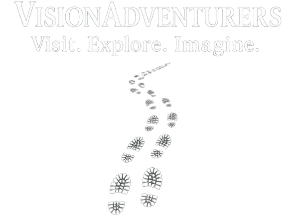 Vision Adventurers logo The website logo has the name Vision Adventurers in bold caps. Immediately under this text is the site’s tagline Visit. Explore. Imagine. The final element is an image of winding footprints moving toward the text from below. The steps signify life’s winding road and the Vision Adventurer’s journey.