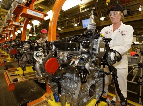Anna associate, Amie Tierman performs an install process on one of the plant's new turbo engines.