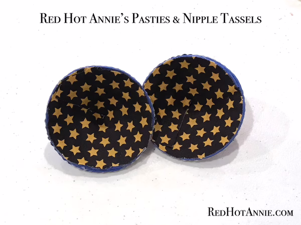 Close-up of evil eye rhinestone pasties showing detailed craftsmanship