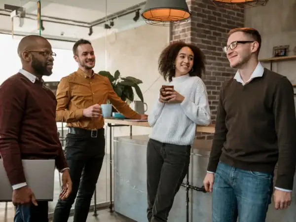 A group of people standing around each other.
