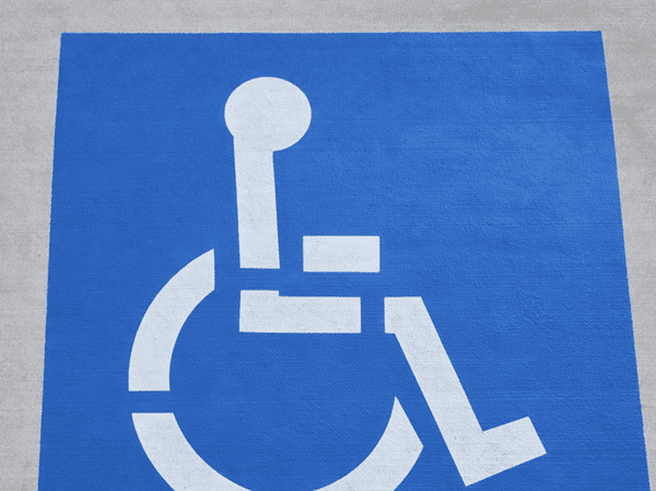 ADA-compliant handicap parking stall with ISA symbol freshly painted in North Houston TX