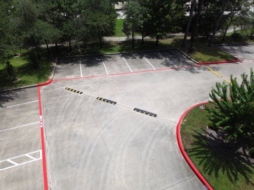 Fire lane curb painting at a commercial lot in The Woodlands, TX