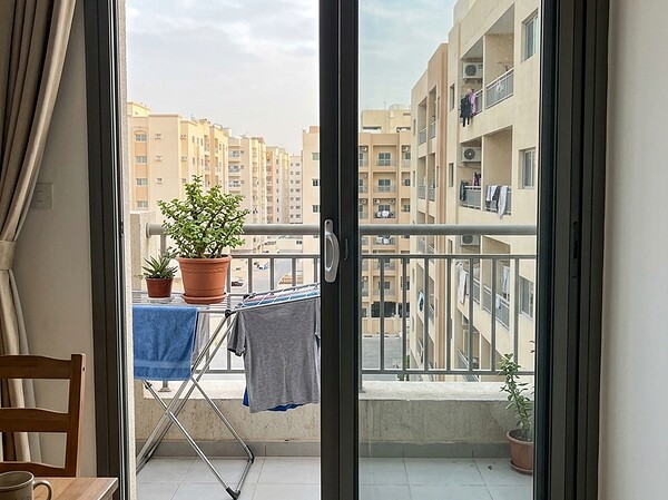Slim aluminium sliding windows on a Sharjah apartment balcony