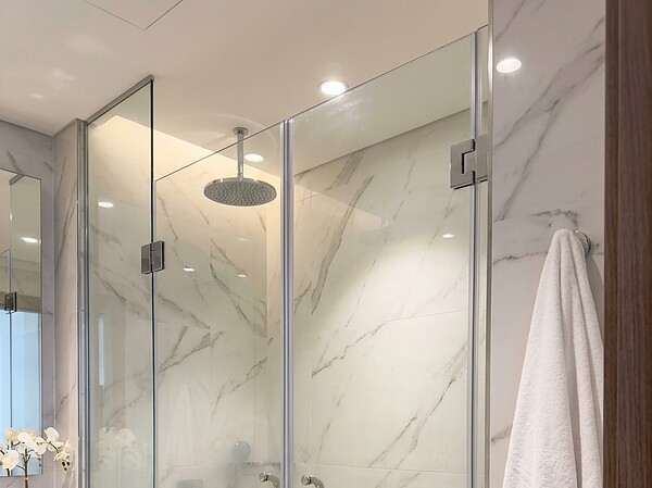 Frameless glass shower screen in a Downtown Dubai bathroom
