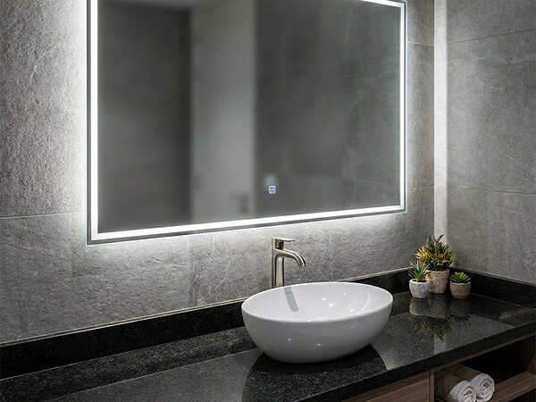 Large backlit washroom mirror in a Business Bay office