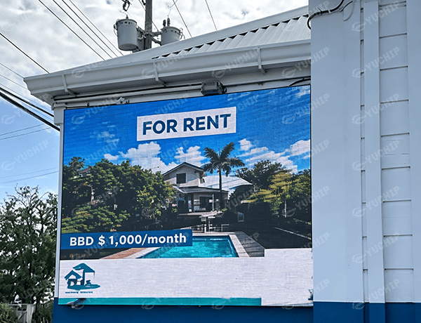 Outdoor Eco Pro series LED display showing a “For Rent” real estate advertisement, installed in 2025 through a referral from the original Barbados hotel customer