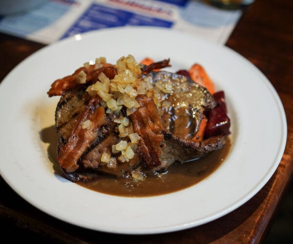 Delicious chicken wings from The Morrissey House, crispy and perfectly seasoned, served with a side of dipping sauce.