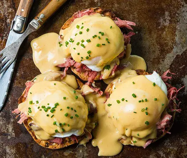 Eggs Benedict, a signature dish at The Morrissey House, perfect for a celebratory brunch with rich hollandaise sauce and perfectly poached eggs.