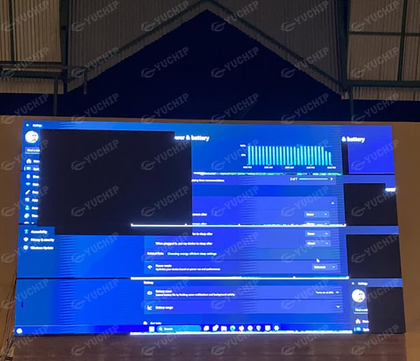 Windows power and battery settings interface displayed on the outdoor LED screen during remote troubleshooting