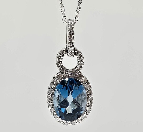 10k 1.40ct Blue Topaz and .15ctw Diamond Halo Necklace