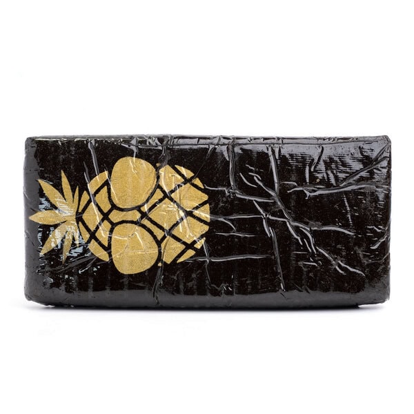 Hand-pressed Philosophers Stone Blueberry Hash with dark exterior and pliable consistency