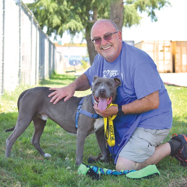 Former Raley's executive Nereo Rebellato with american pit bull terrier porky