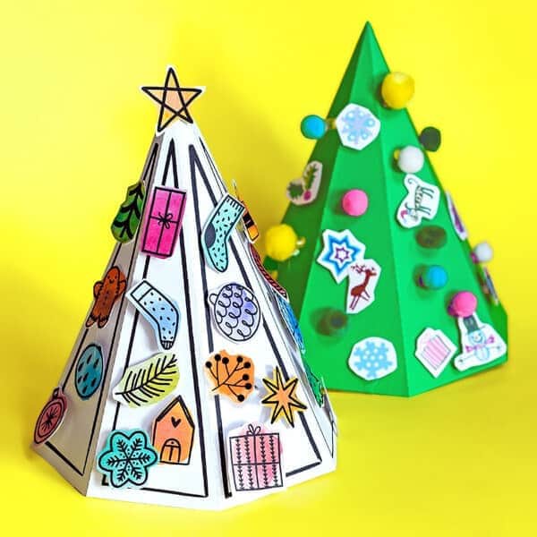 3d paper advent tree craft made with paper on a yellow backdrop