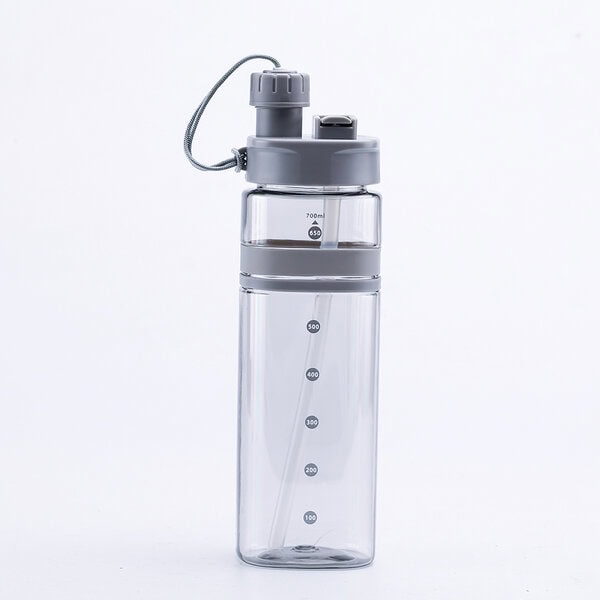 Transparent 700ml plastic water bottle with built-in straw and measurement markings