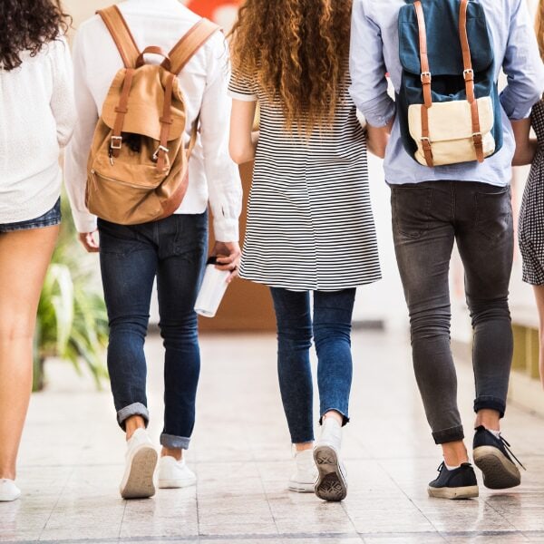 Teen students in recovery walking down a school hallway at Archway Academy, representing youth support, substance use recovery, and academic progress