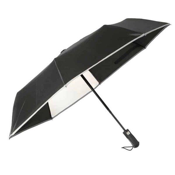 Avattu sateenvarjo ikkunalla ja heijastinnauhalla.