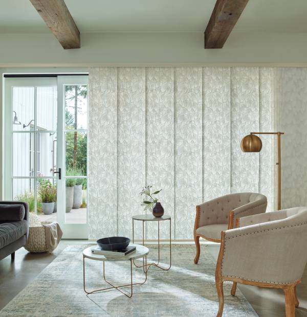 Bright, airy living room with elegant curtains, modern furniture, and natural lighting.