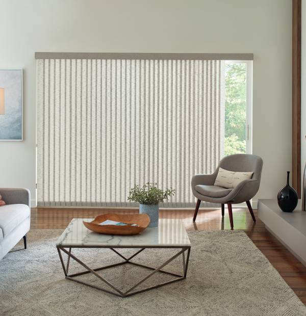 Vertical window blinds in a modern living room with natural light.