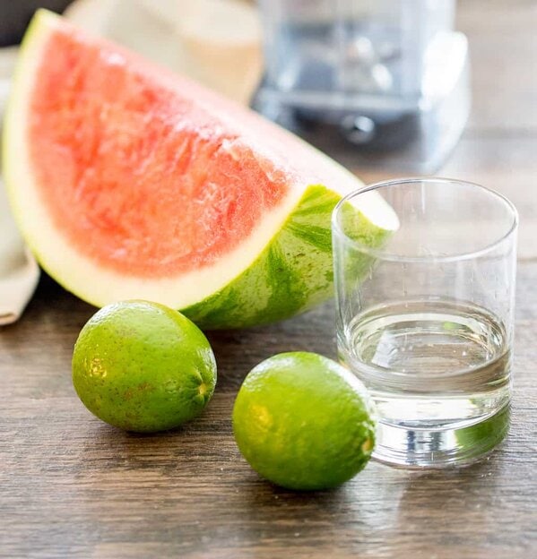 ingredients for tequila watermelon cocktail: watermelon, tequila, lime