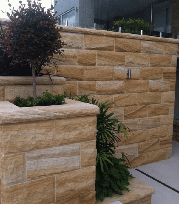 Australian banded rockface sandstone in a residential walling project. Rock face sandstone