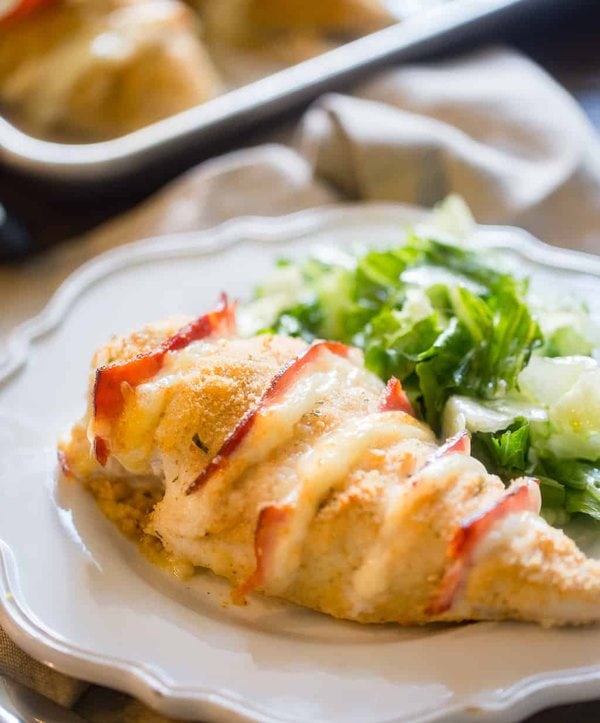 Baked Chicken Cordon Bleu on a plate with side salad