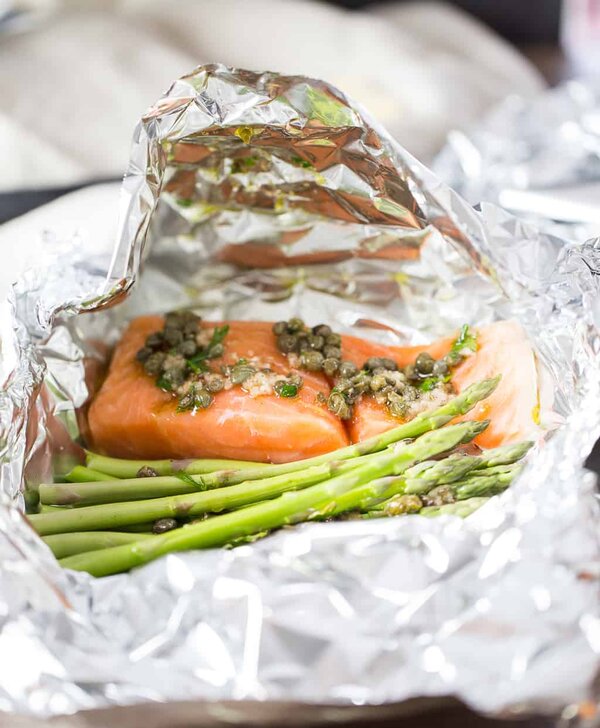 salmon foil packets with vegetables about to go into the oven