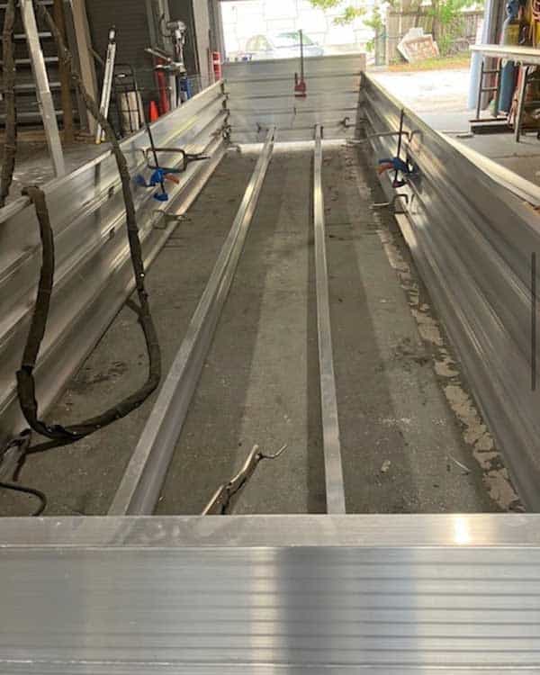 Large-scale aluminum dock frame under construction in Supreme Marine warehouse