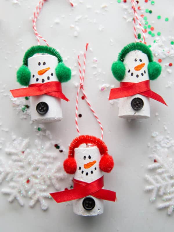 Christmas snowman ornaments made with cork with a white backdrop