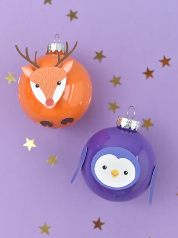 animal themed DIY Christmas ornaments featuring a reindeer and a purple penguin