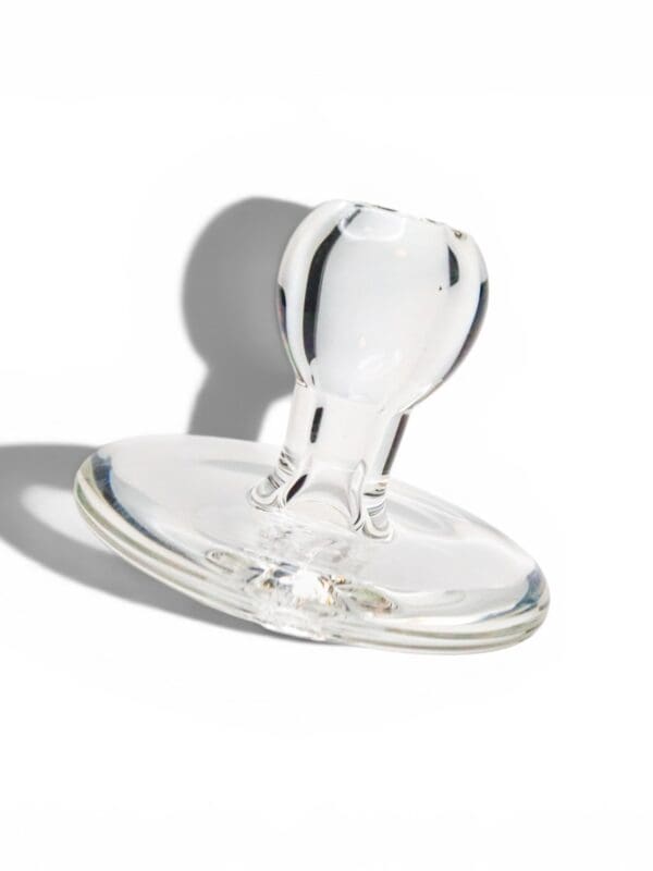 Clear borosilicate glass Terp Trunk directional carb cap with rounded airflow handle.