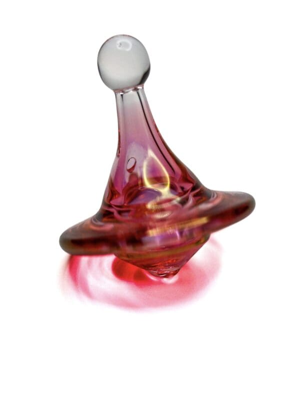 Ruby Spinner Carb Cap with red glass body, wide saucer cap, white rounded handle, and airflow hole.