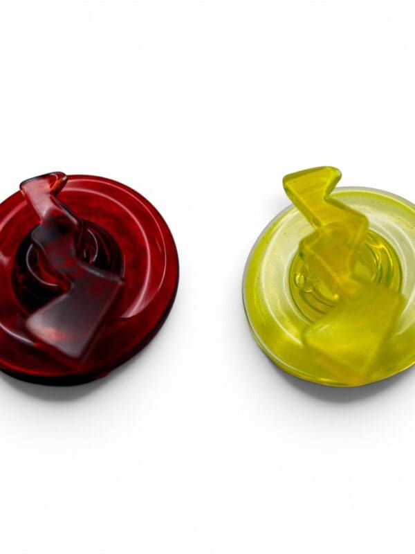 Ruby red directional glass carb cap shown with raised handle and airflow design.