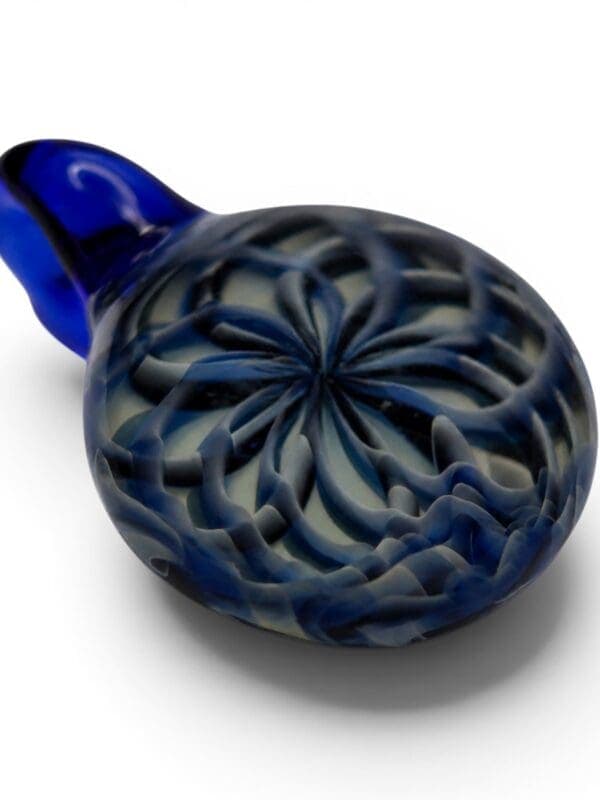 Angled view of Blue Ornamental Smudge Cap Pendant with layered blue floral pattern and smoky glass finish.