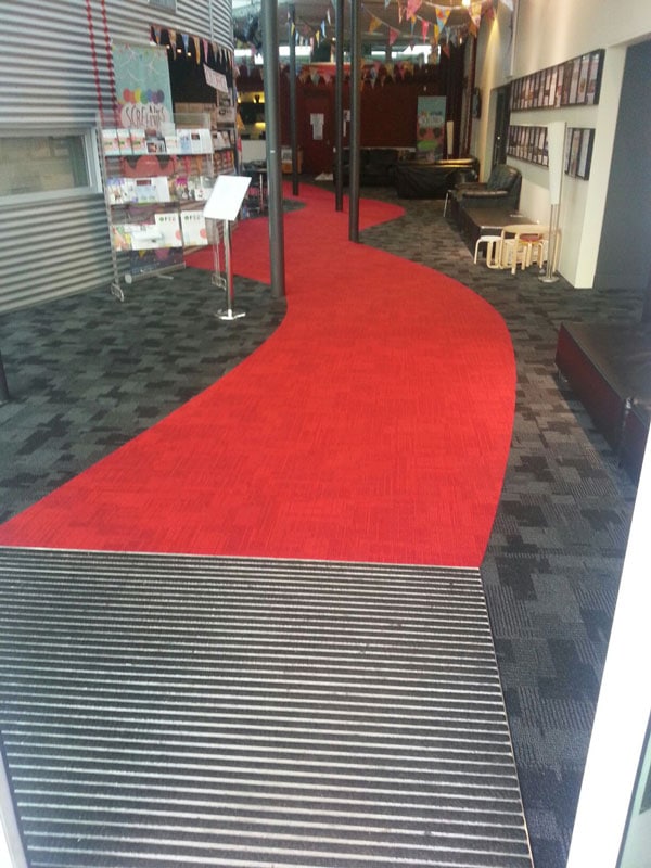 The Auckland Performing Arts Centre Inzide carpet tiles with a free hand drawn red walkwa