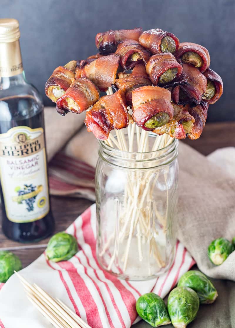 brussels sprouts wrapped in bacon on skewers like a bouquet