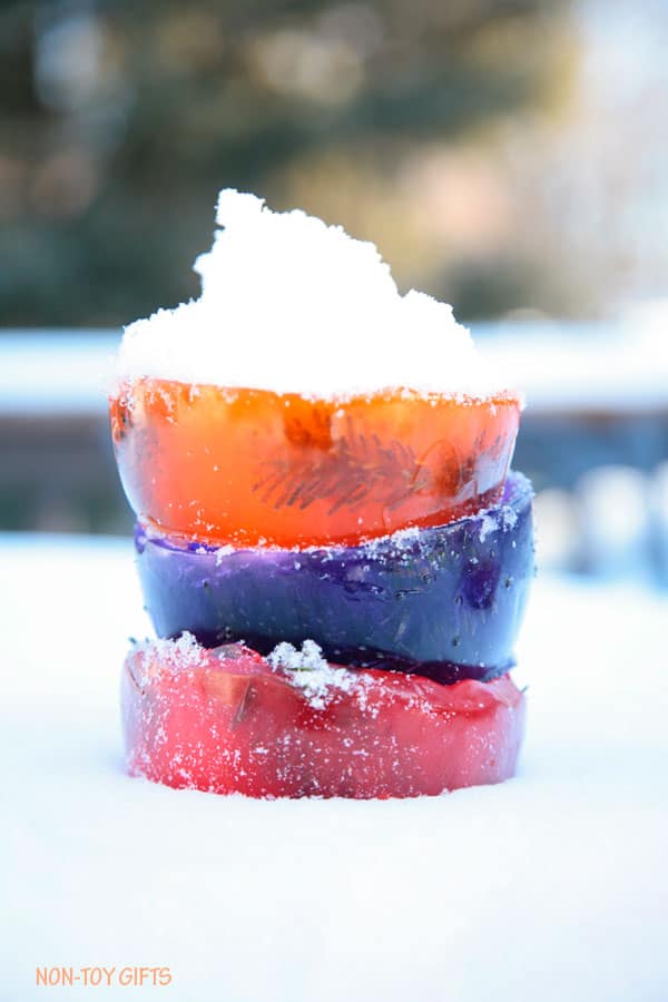 colorful ice bowls made with ice stacked on top of snow