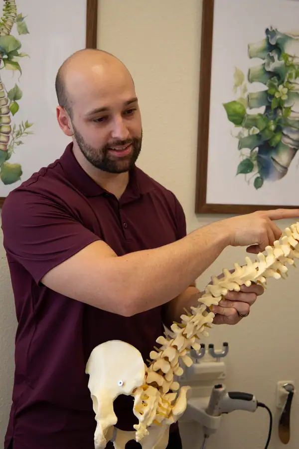 Dr. Matt explains spinal health to a patient in palm desert, CA.