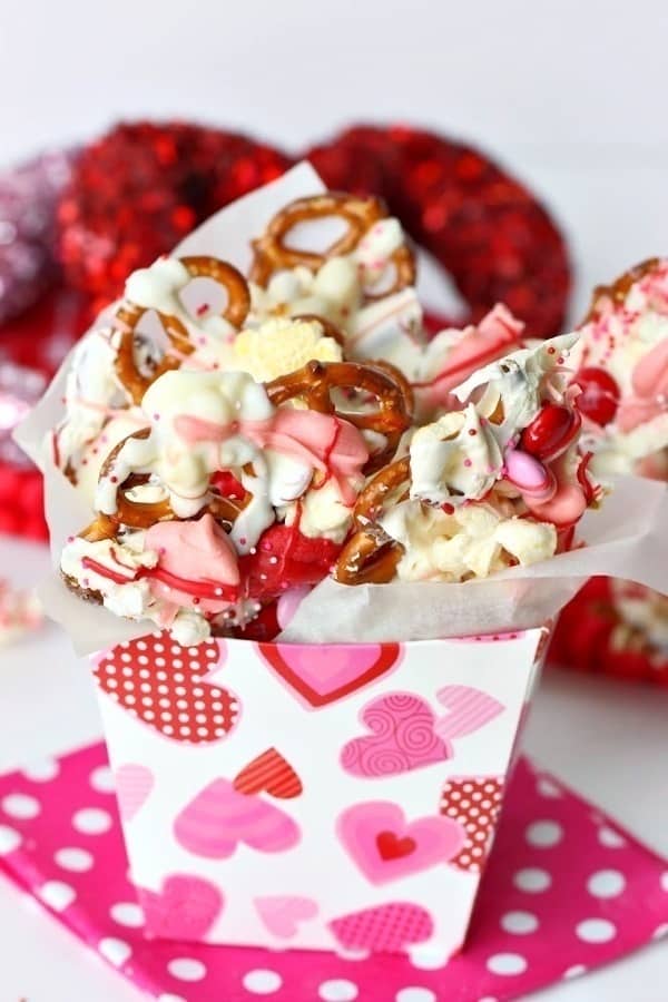 This easy Sweetheart Bark recipe is sure to capture the heart of your Valentine. You can't go wrong with a sweet snack filled with popcorn, pretzels and melted chocolate.