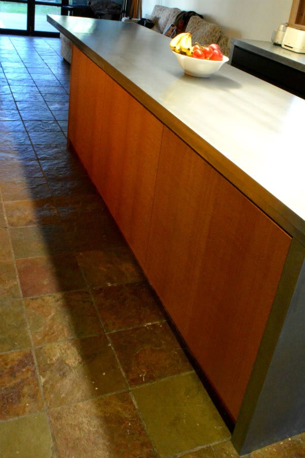 Silky oak doors part of a custom made kitchen. Custom made joinery and cabinet making. With Miter detail doors