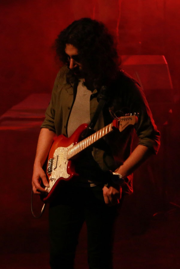 Dariush Meshkin playing electric guitar live