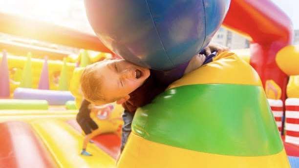 Girl playing on obstacle course