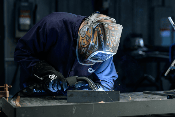 Welder using clean air e fume extraction gun
