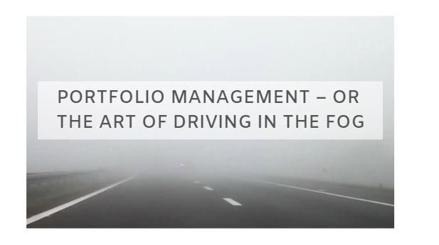 Portfolio management concept with foggy road background.