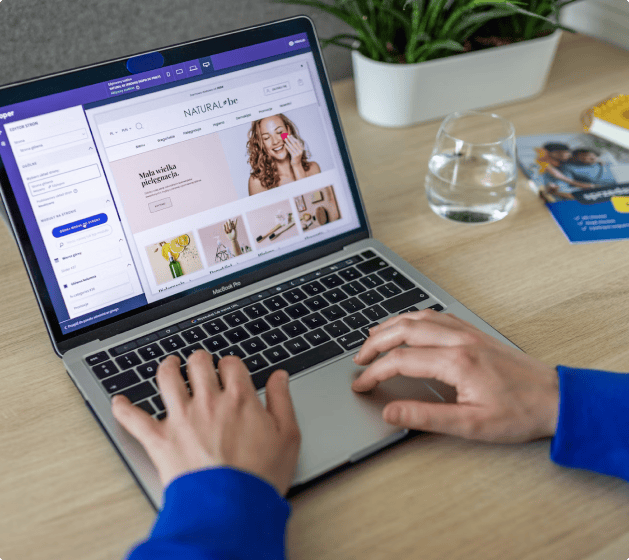 Person using a laptop to manage a Shopify online store