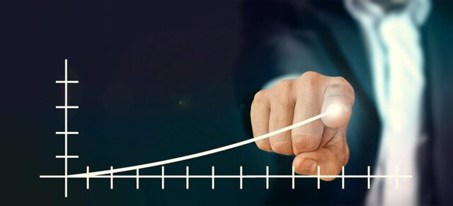 Businessman reviewing investment charts, representing crowdfunding as a passive income idea