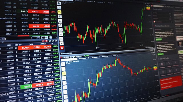 Stock market trading screens with live data and charts.