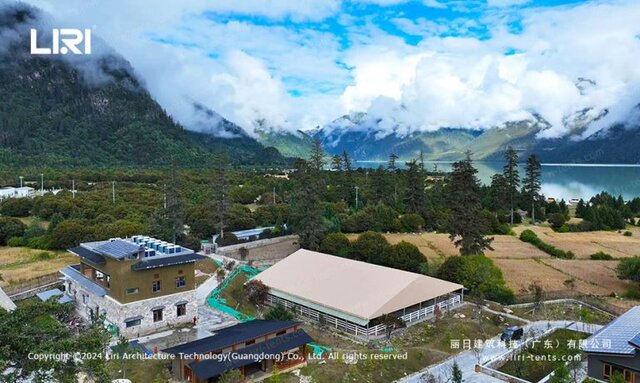 Mountain event tent aerial view over equestrian arena