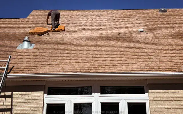 Roof repair in St. James Community Southport NC by RGR Construction & Roofing showing professional shingle repair on a residential home